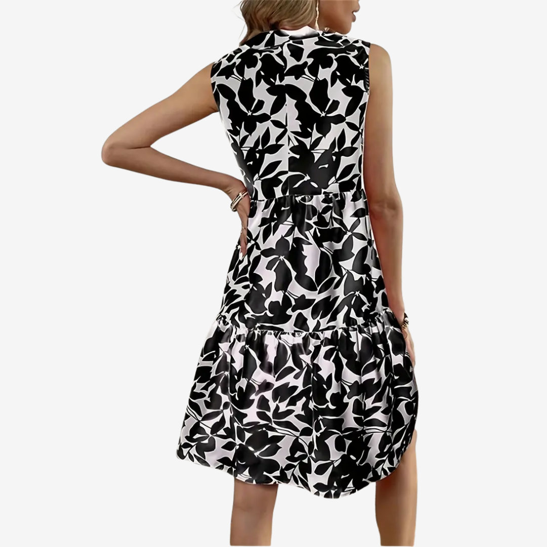 Daphne | stilvolles Midikleid, ausgestellter Schnitt, Blumendetails.