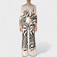 Audi | Schulterfreies Oberteil und Hose mit weitem Bein und frechem Print